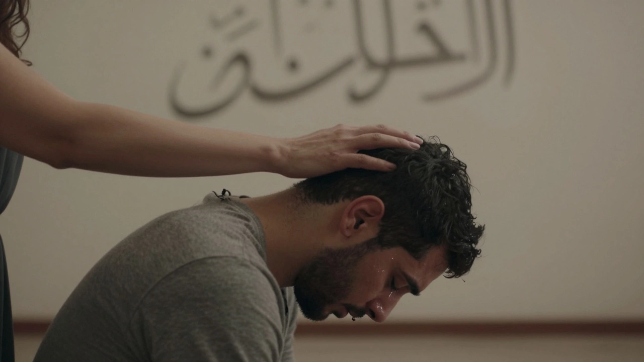 A woman’s hand rests gently on a man’s head as he weeps silently, bathed in soft light, no objects, only emotion.